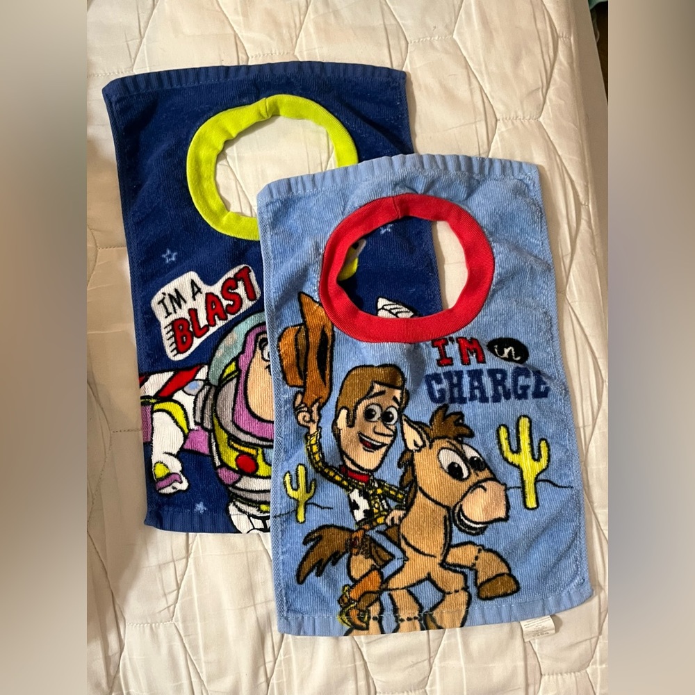 Toy Story bibs (2) one Woody and one Buzz. Towel like material.